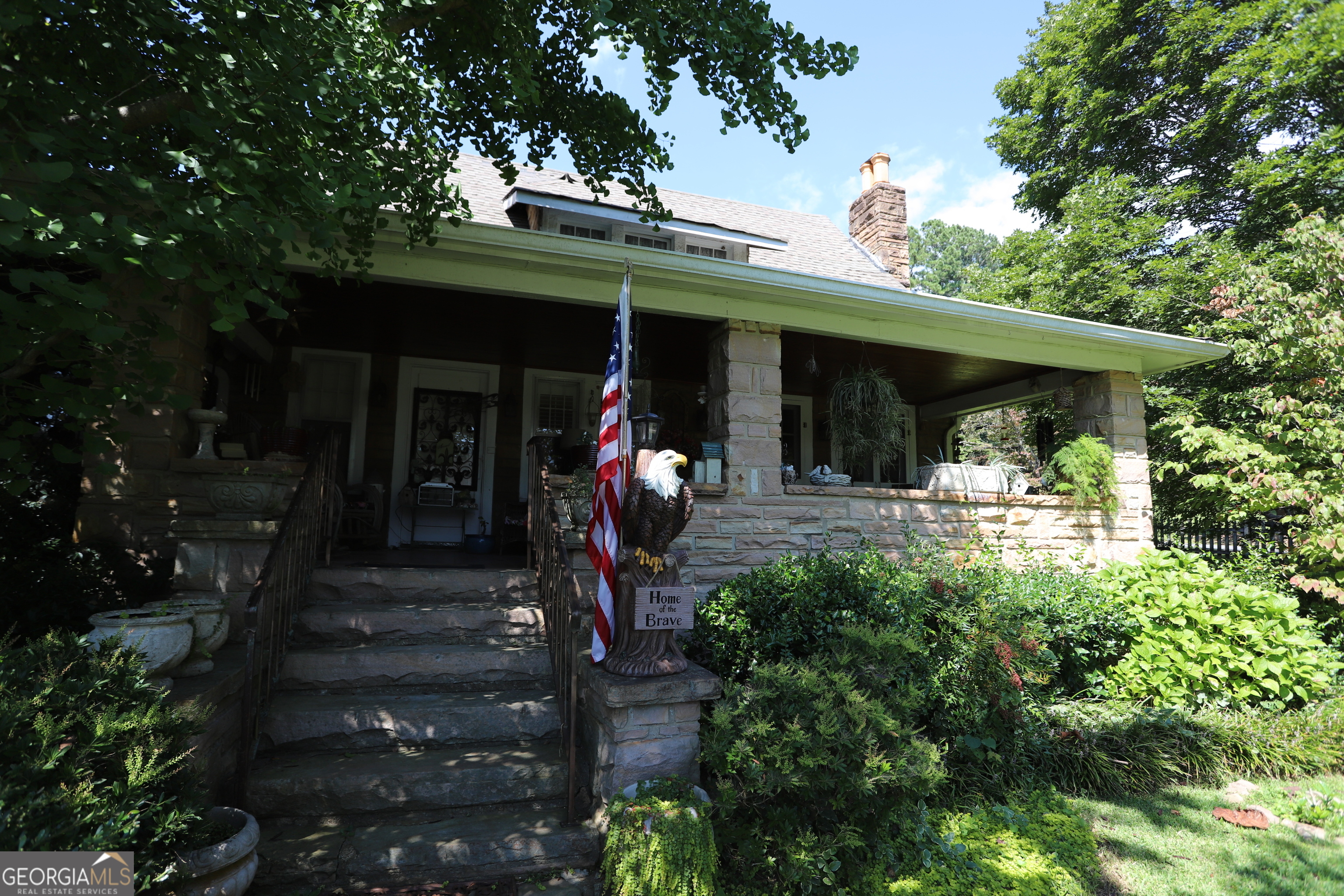 360 Edison Street Menlo, GA 30731 - Photo 6 of 64 a front view of a house with lots of green space