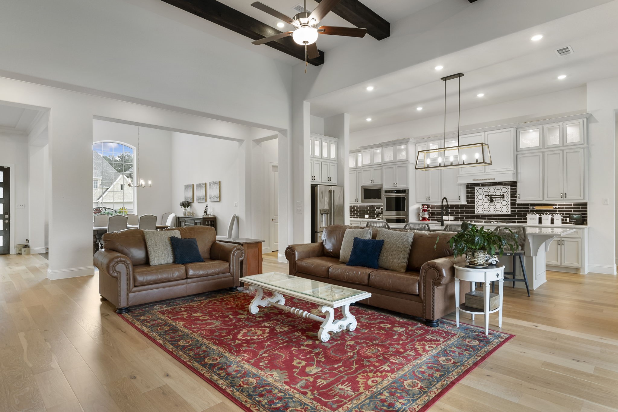 12932 Whitewater Way Conroe, TX 77302 - Photo 8 of 48 The open-concept kitchen and family room create a warm and inviting gathering space.