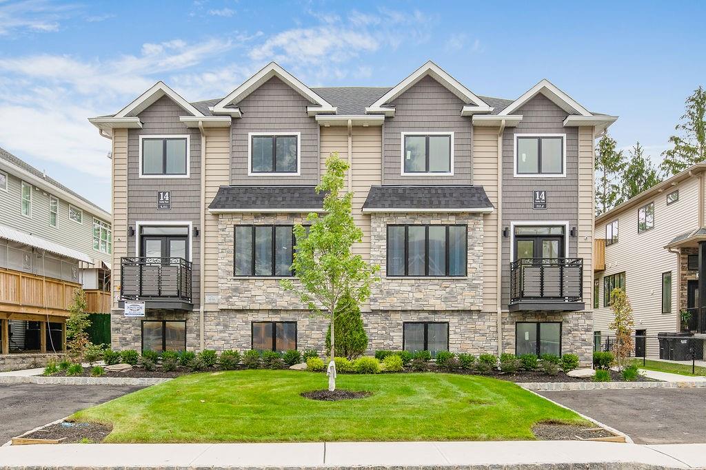 14 Valley View Terrace, Unit 211 Spring Valley, NY 10977 - Photo 1 of 1 a front view of a house with a yard