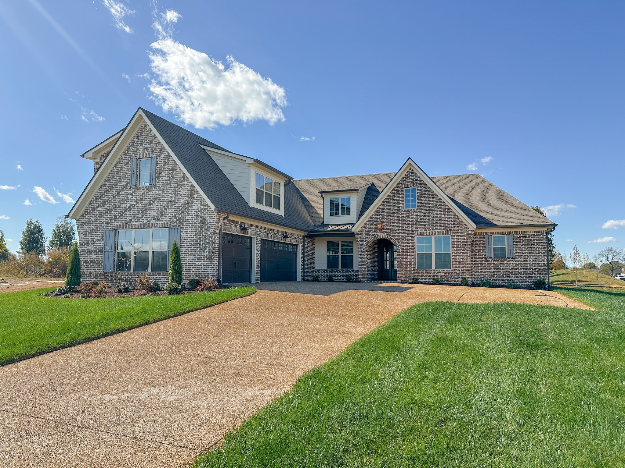 404 Bell Lk Road Gallatin, TN 37066 - Photo 2 of 35 a front view of a house with a yard and garage
