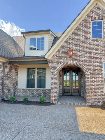 a front view of a house with yard