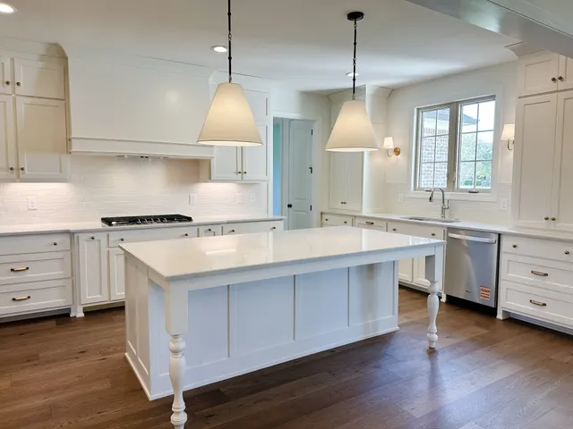 a spacious bathroom with a double vanity sink and a mirror