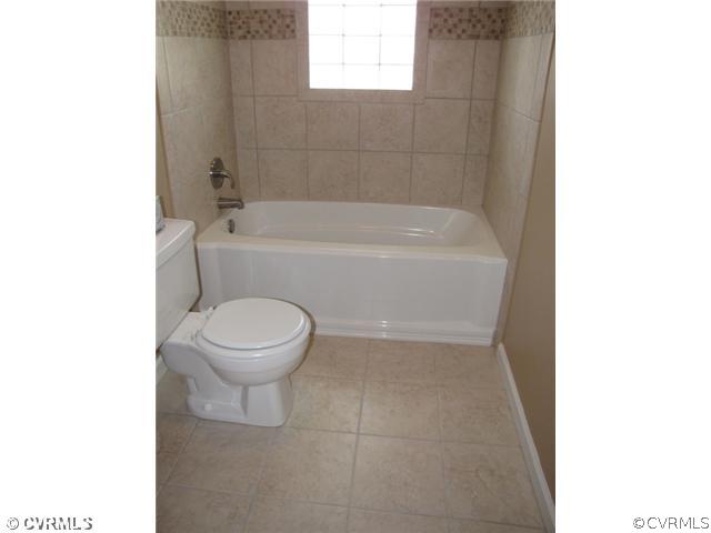 467 Crymes Orchard Road Keysville, VA 23947 - Photo 7 of 13 a bathroom with a toilet and a bathtub