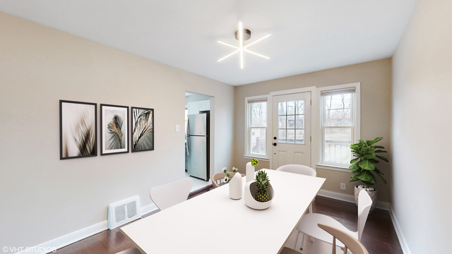 9849 South Charles Street Chicago, IL 60643 - Photo 8 of 19 a view of a dining room with furniture and chandelier