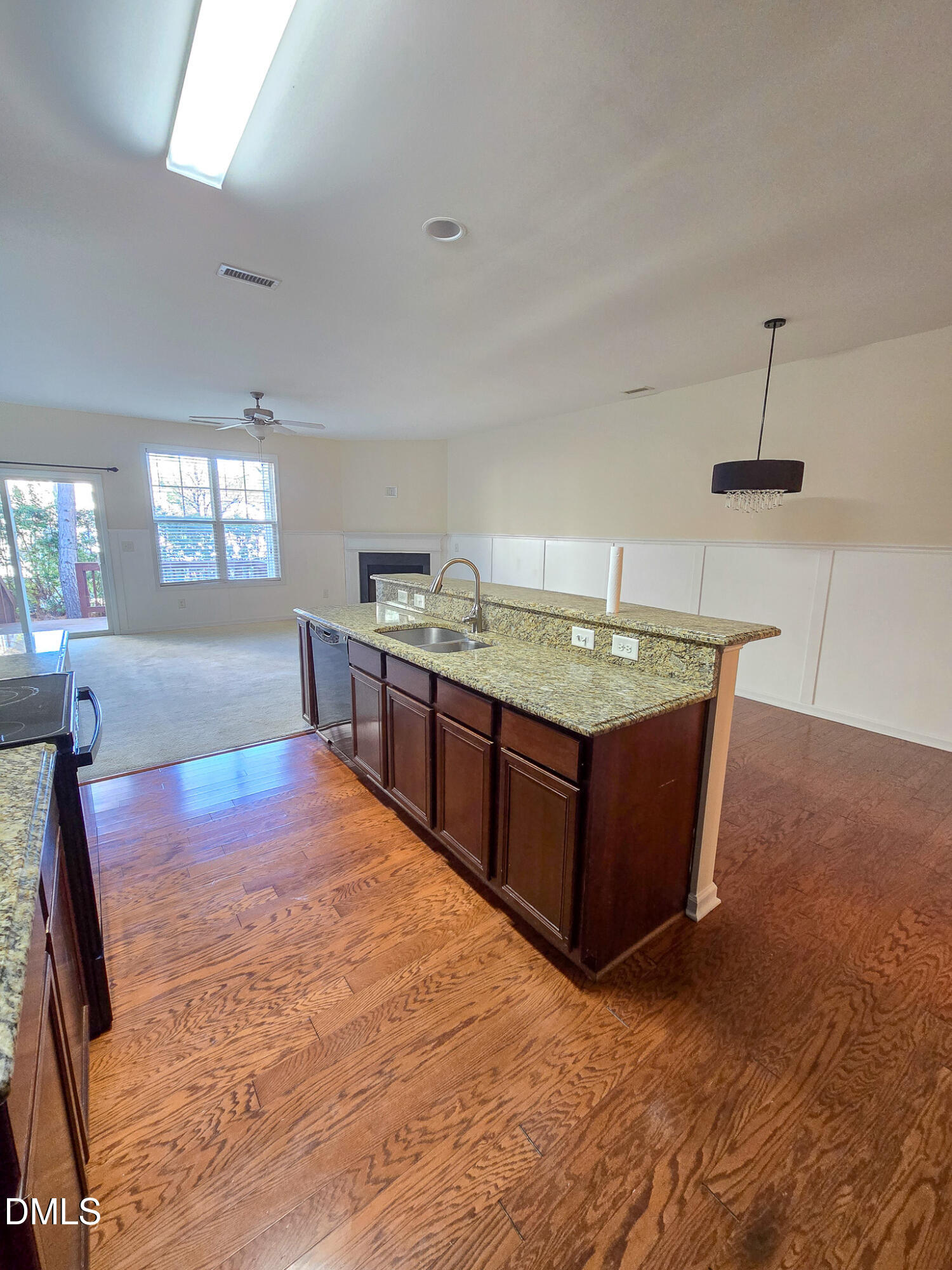4609 Pat Reed Road Raleigh, NC 27616 - Photo 13 of 42 a kitchen with stainless steel appliances granite countertop a stove a sink and a refrigerator
