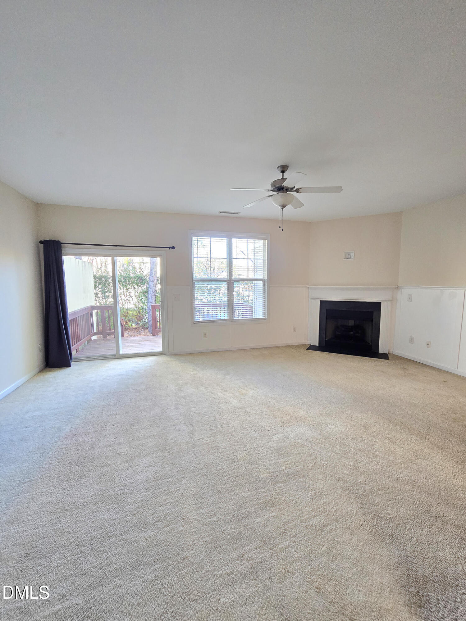 4609 Pat Reed Road Raleigh, NC 27616 - Photo 18 of 42 an empty room with windows and ceiling fan