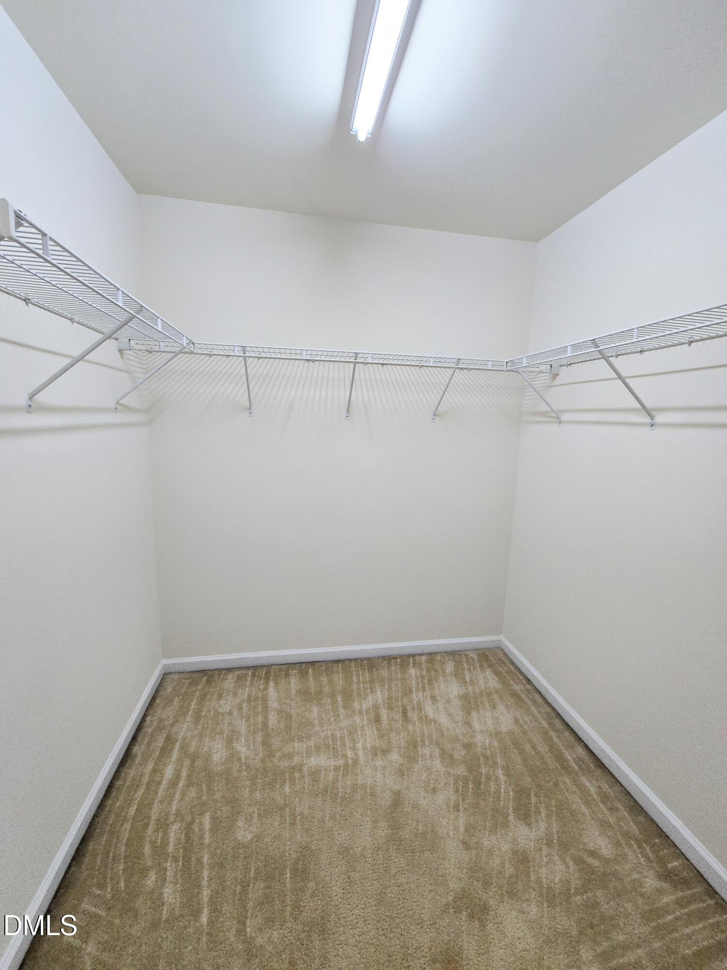 4609 Pat Reed Road Raleigh, NC 27616 - Photo 23 of 42 a view of a room with racks on the wall