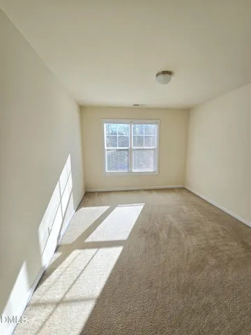 a view of wooden floor and bathroom