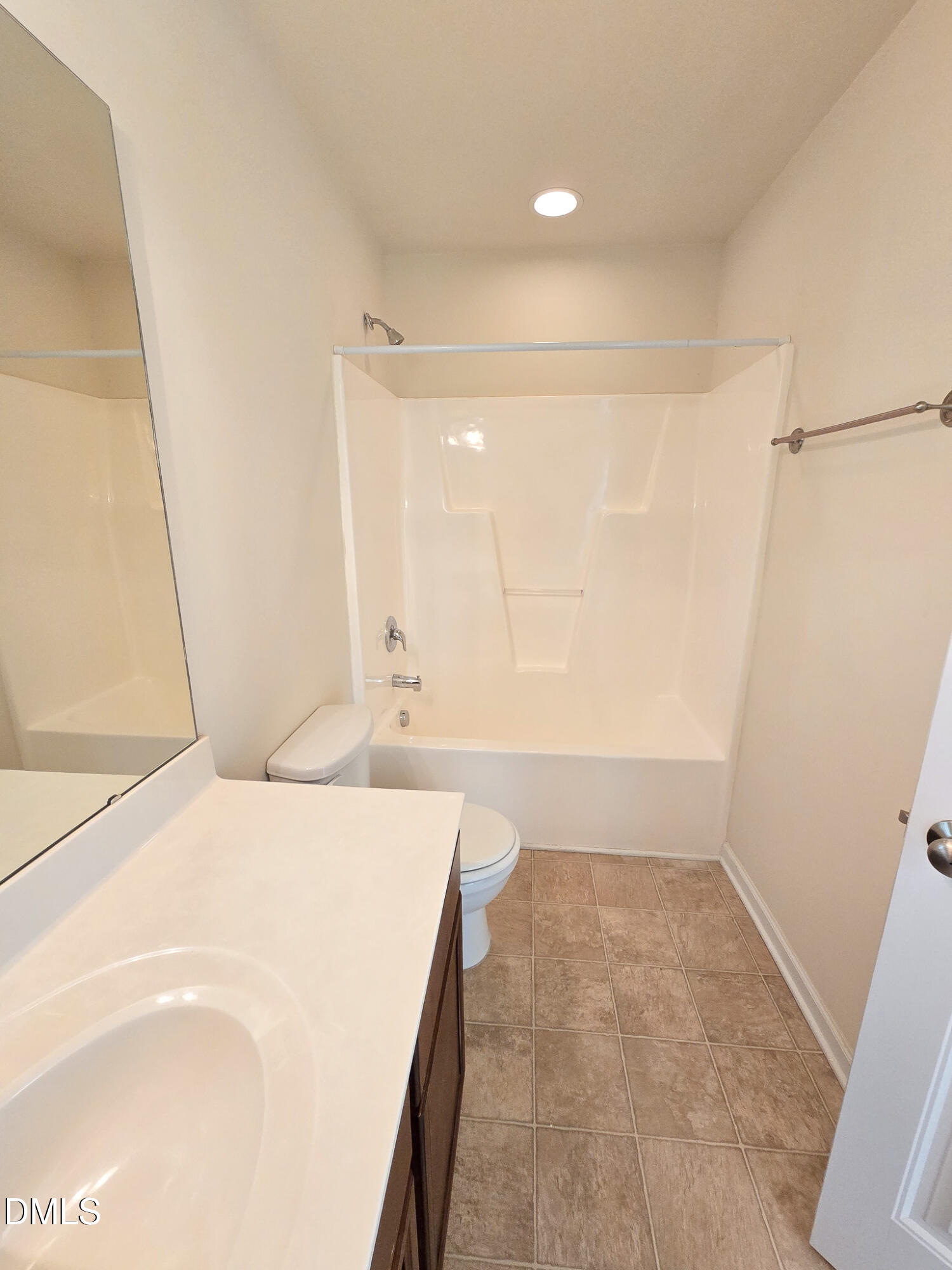 4609 Pat Reed Road Raleigh, NC 27616 - Photo 36 of 42 a bathroom with a bathtub and a shower