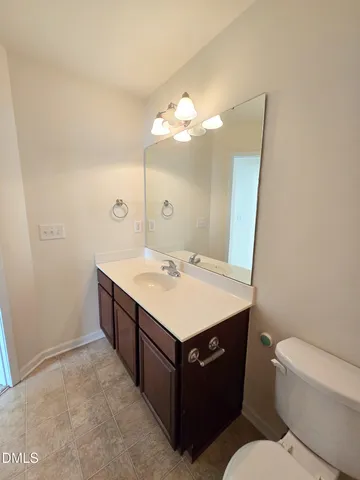 a balcony with wooden floor and fence