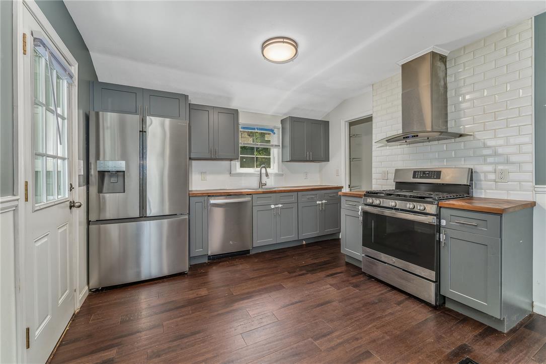 1331 Ridge Trail Easton, PA 18040 - Photo 6 of 22 A well-equipped kitchen features sleek stainless steel appliances and rich wood flooring.