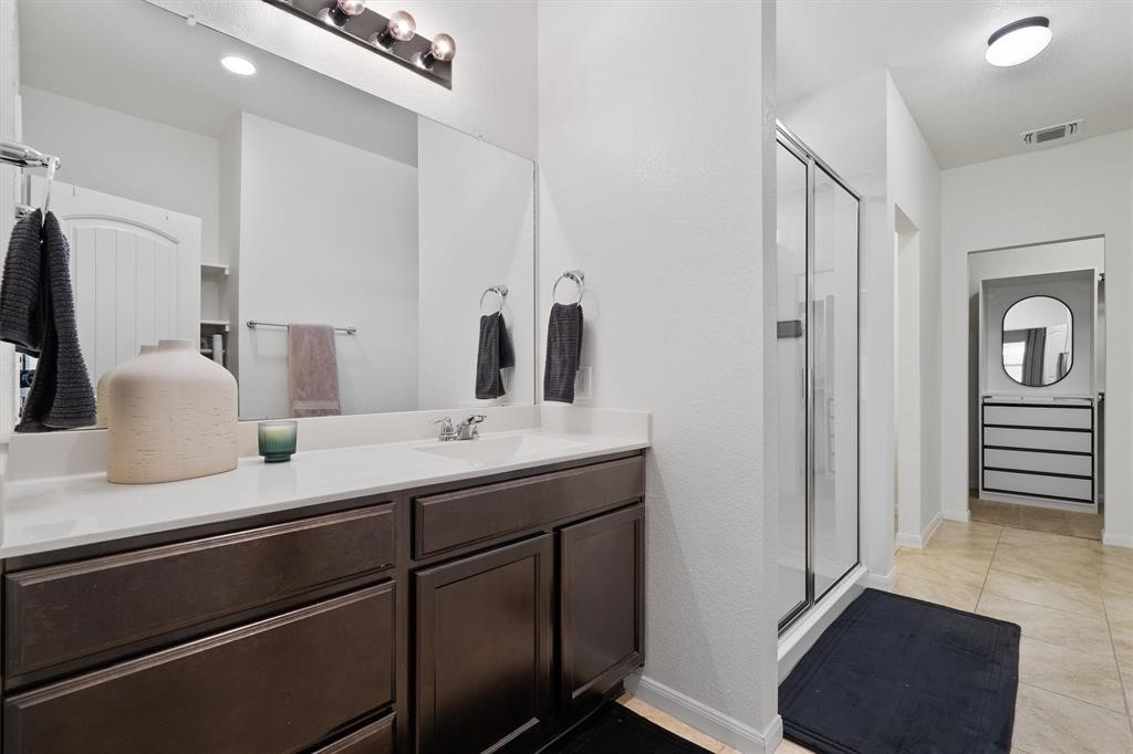 10308 Hatton Lane Austin, TX 78754 - Photo 11 of 25 Spacious primary bathroom with dual vanity, ample counter space, and a functional layout designed for everyday ease