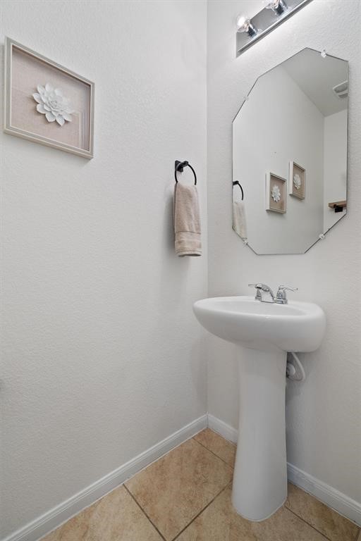10308 Hatton Lane Austin, TX 78754 - Photo 14 of 25 Well-appointed half bath on the main level, ideal for guests and everyday convenience