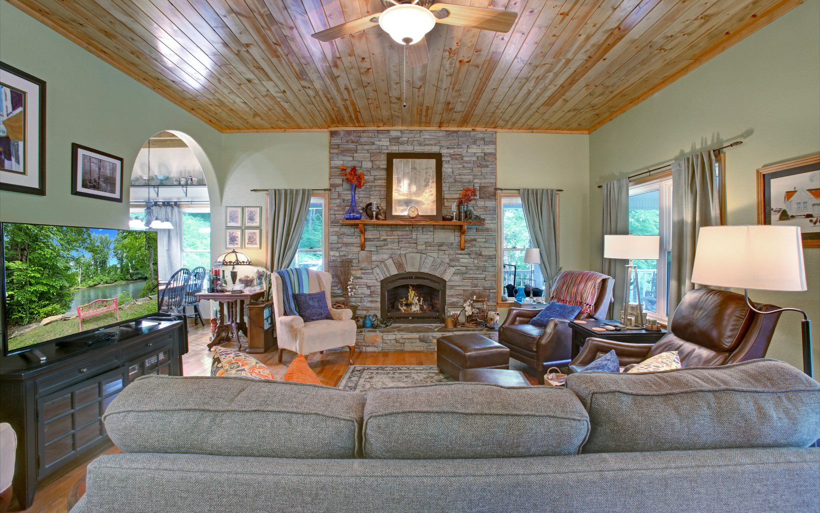 320 Hiawassee River Road Murphy, NC 28906 - Photo 3 of 4 a living room with furniture and a fireplace