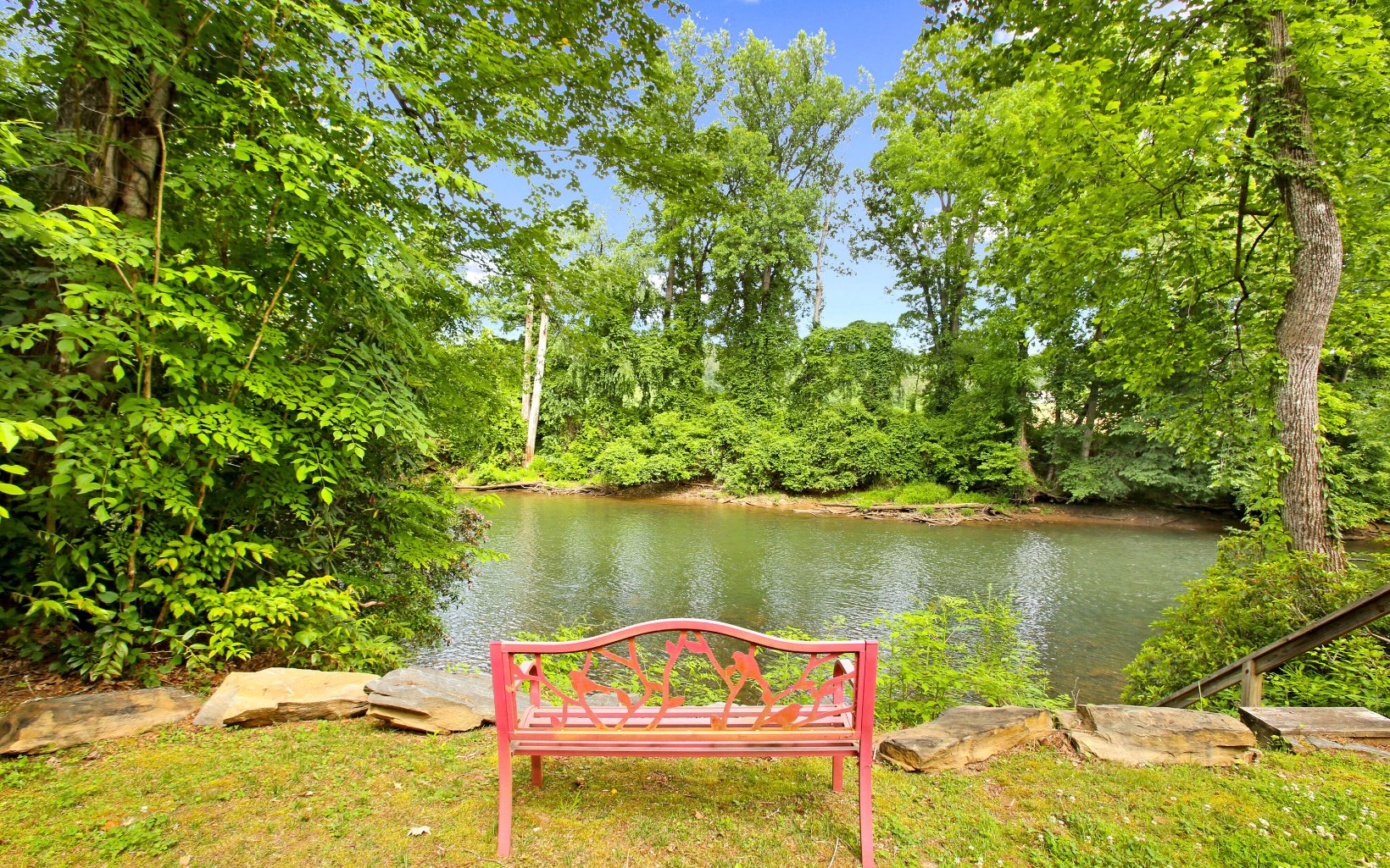 320 Hiawassee River Road Murphy, NC 28906 - Photo 4 of 4 a view of a lake with a house in the background