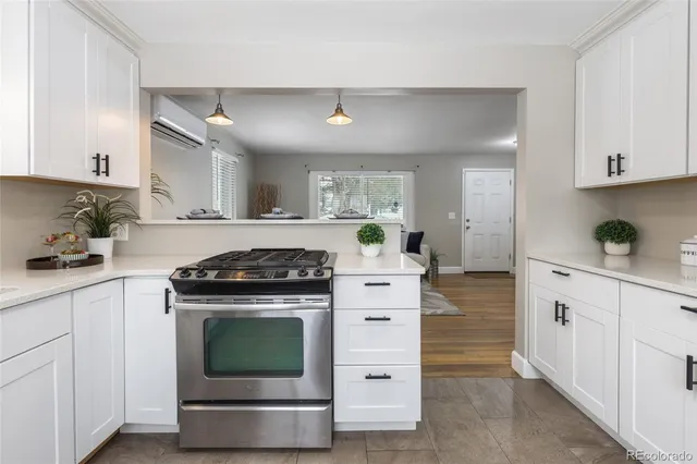 a kitchen with cabinets appliances and a sink