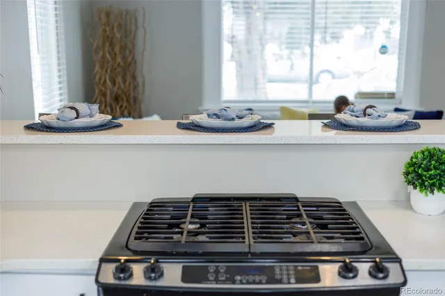 a stove top oven sitting inside of a kitchen