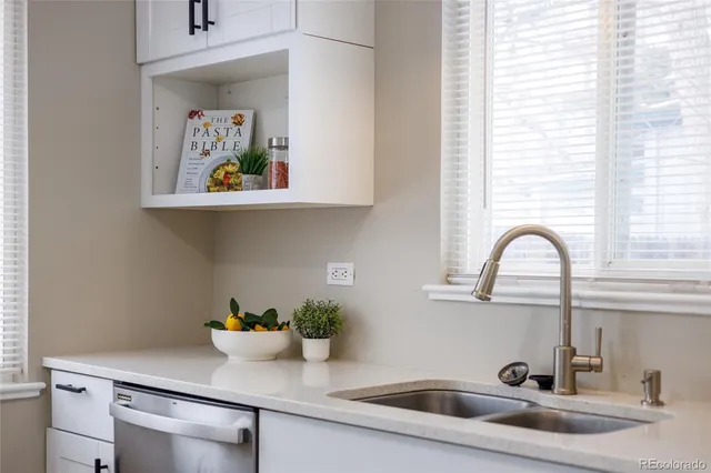 a bathroom with a sink and a window