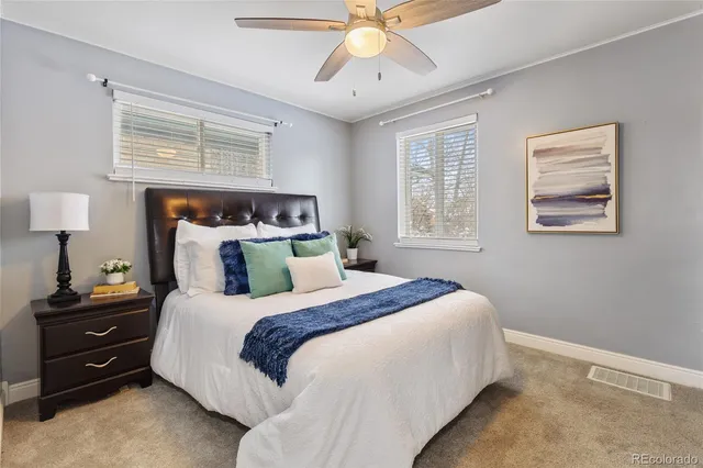 a bedroom with bed and a window