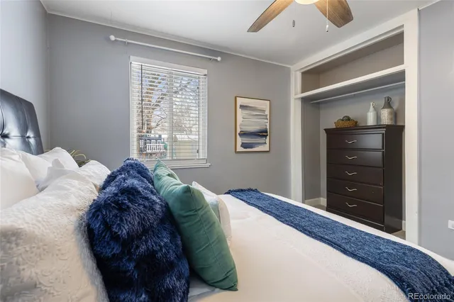 a bedroom with a bed and a dresser