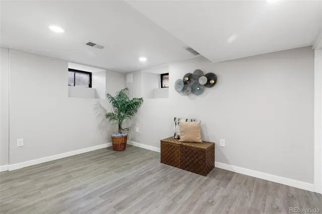 a room with chair and wooden floor