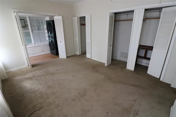 an empty room with a fireplace