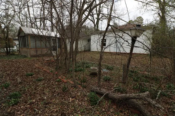a backyard of a house with lots of green space