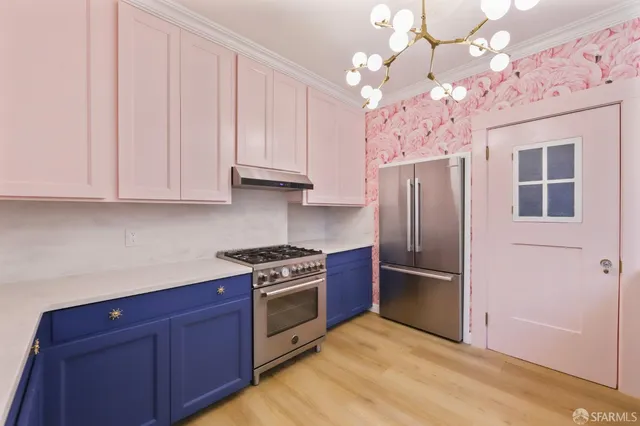 a kitchen with kitchen island granite countertop wooden cabinets and stainless steel appliances