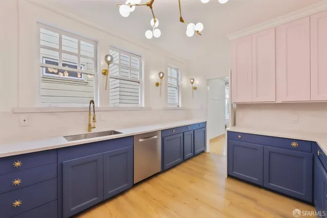 a spacious bathroom with a granite countertop sink a mirror and a bathtub