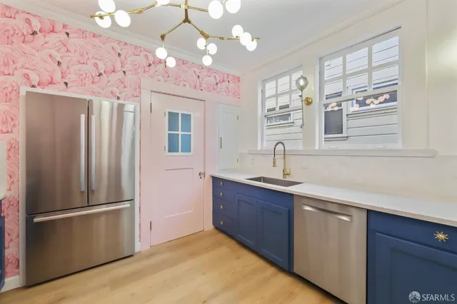 a kitchen with stainless steel appliances granite countertop a refrigerator and a sink