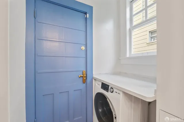 a utility room with dryer and washer