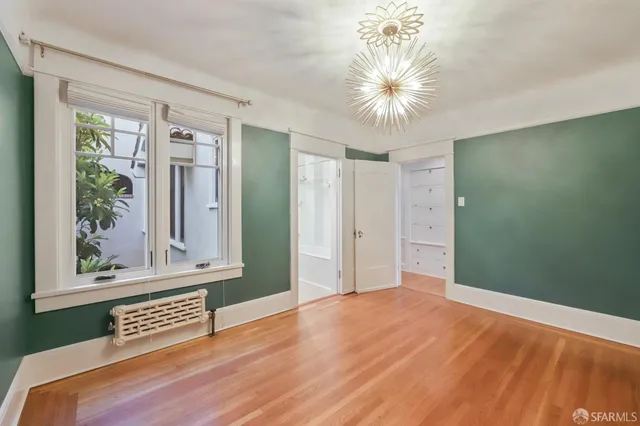 a view of front door with wooden floor