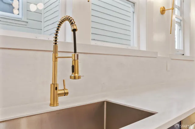 a living room with a fireplace and a table