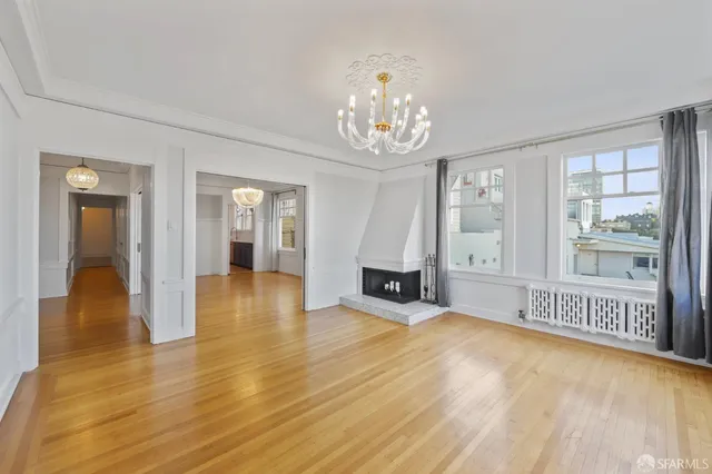 a view of an empty room with glass door