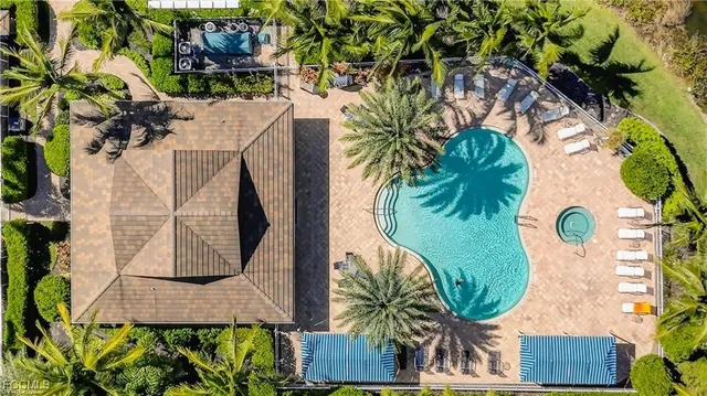 an aerial view of a house with a swimming pool