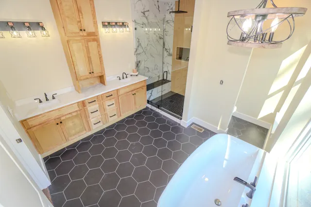 a bathroom with a double vanity sink mirror and