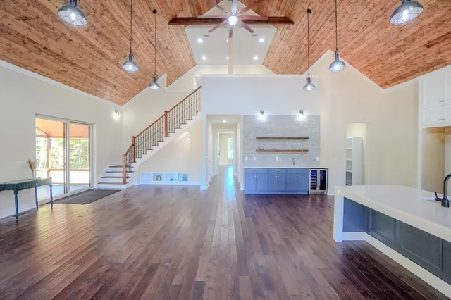 a view of entryway and kitchen with a large window
