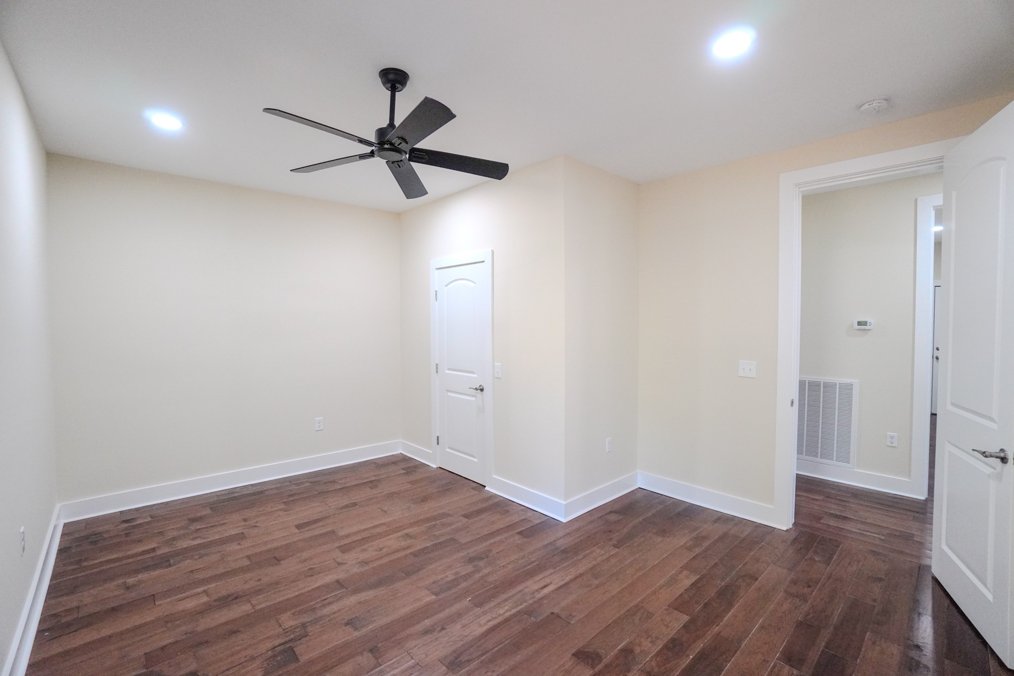 5109 Union Camp Road Lafayette, TN 37083 - Photo 19 of 36 a view of a room with wooden floor and a ceiling fan