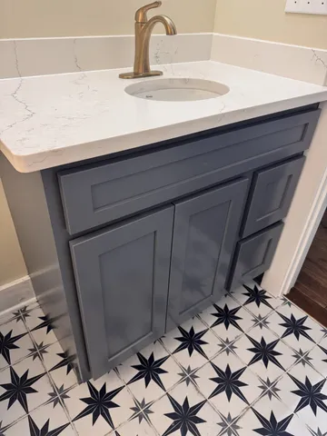 a view of a house with wooden deck and furniture