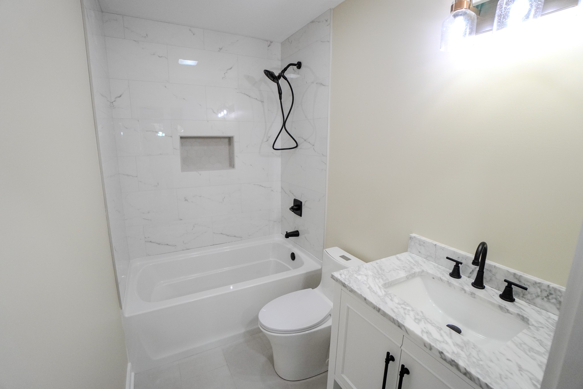 5109 Union Camp Road Lafayette, TN 37083 - Photo 29 of 36 a bathroom with a sink toilet and shower