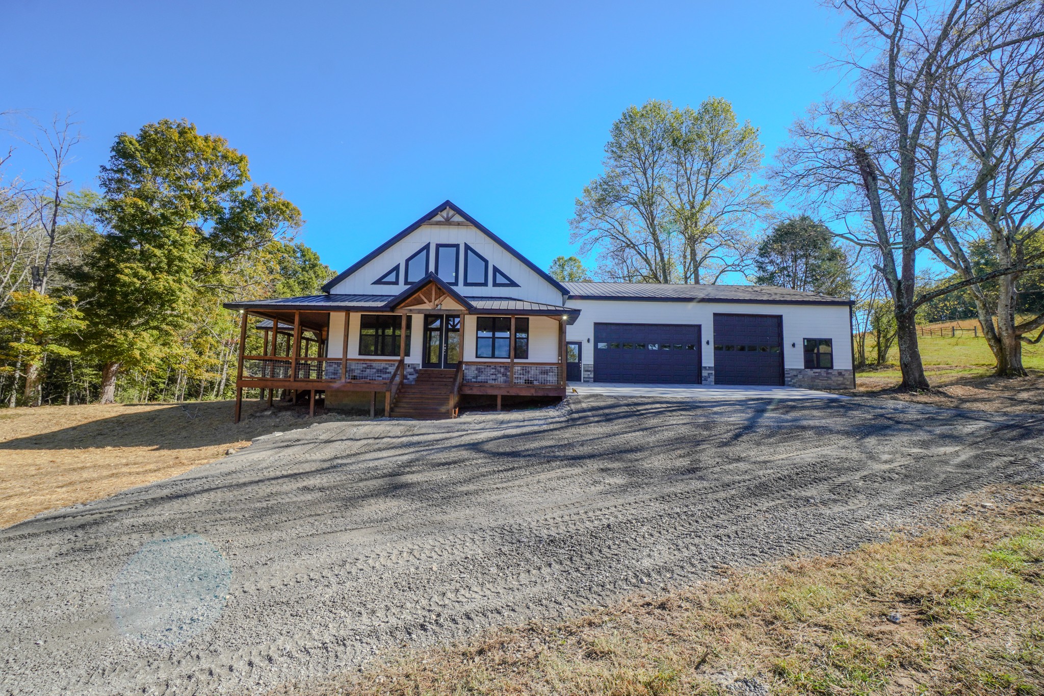 5109 Union Camp Road Lafayette, TN 37083 - Photo 35 of 36 a front view of a house with a garden