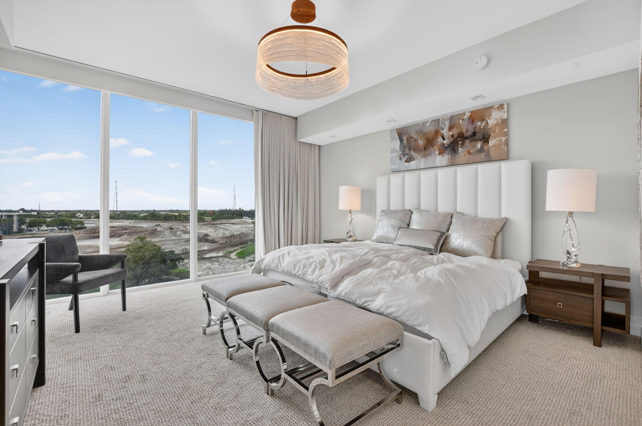 20155 Boca W Drive, Unit B701 Boca Raton, FL 33434 - Photo 4 of 78 a bedroom with a bed lamps and a large window with outer view