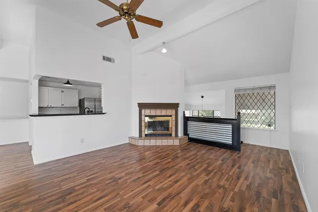 a view of a livingroom with furniture and a fireplace