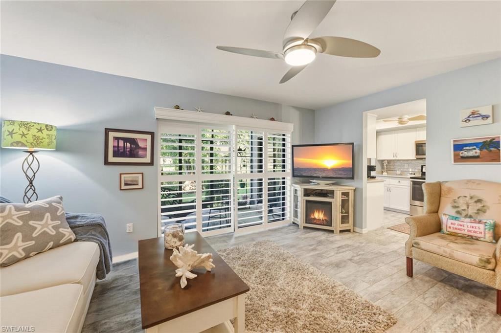 7380 St Ives Way, Unit 1108 Naples, FL 34104 - Photo 1 of 46 FIRE PLACE UNDER TV