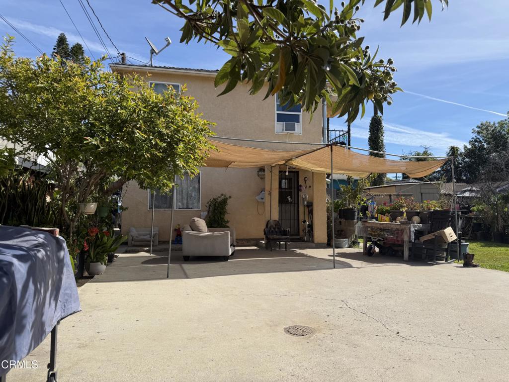321 Walnut Street Santa Paula, CA 93060 - Photo 2 of 4 a view of a patio with a table and chairs under an umbrella