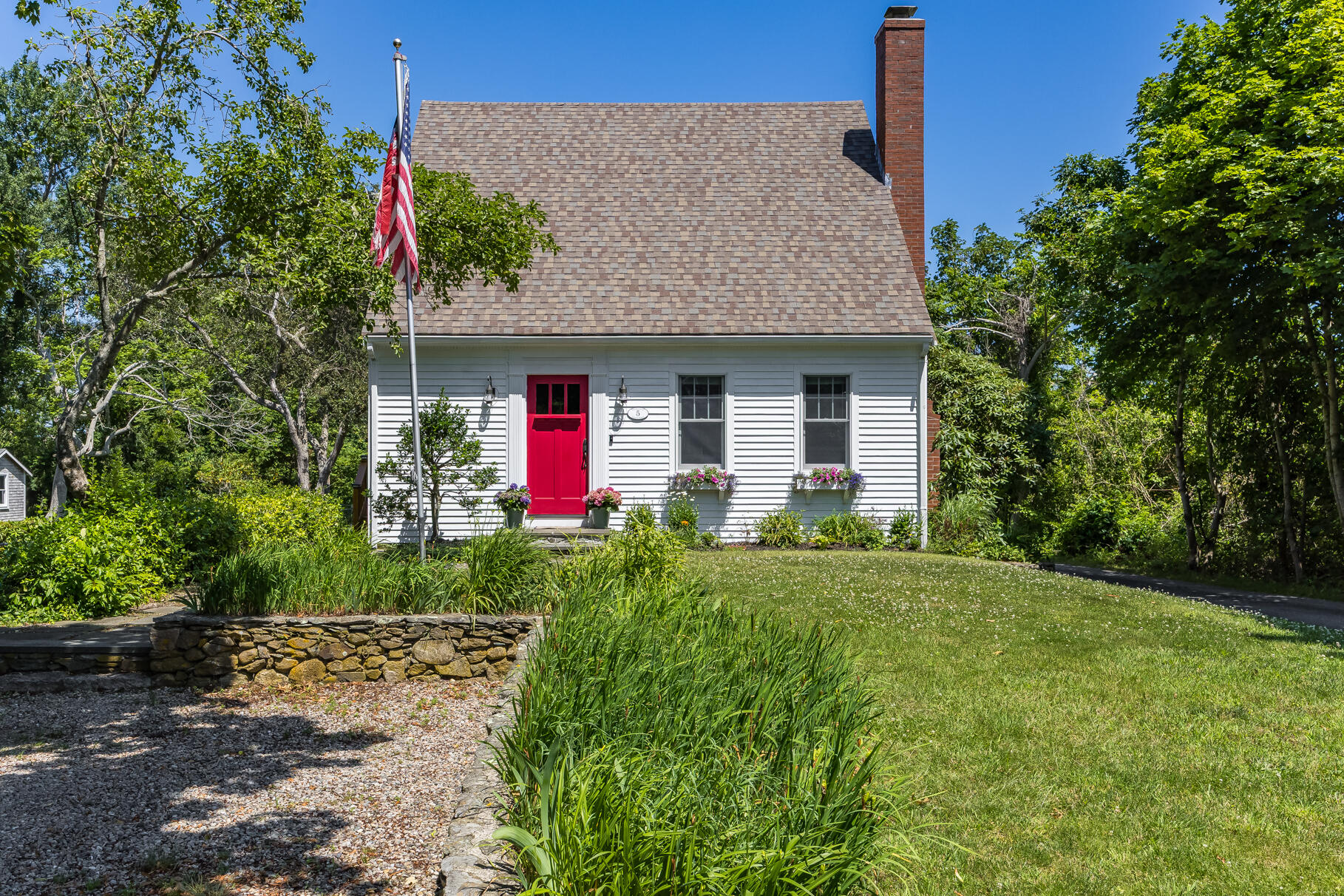 5 Canary Street Sandwich, MA 02563 - Photo 4 of 45 a front view of a house with yard and garage