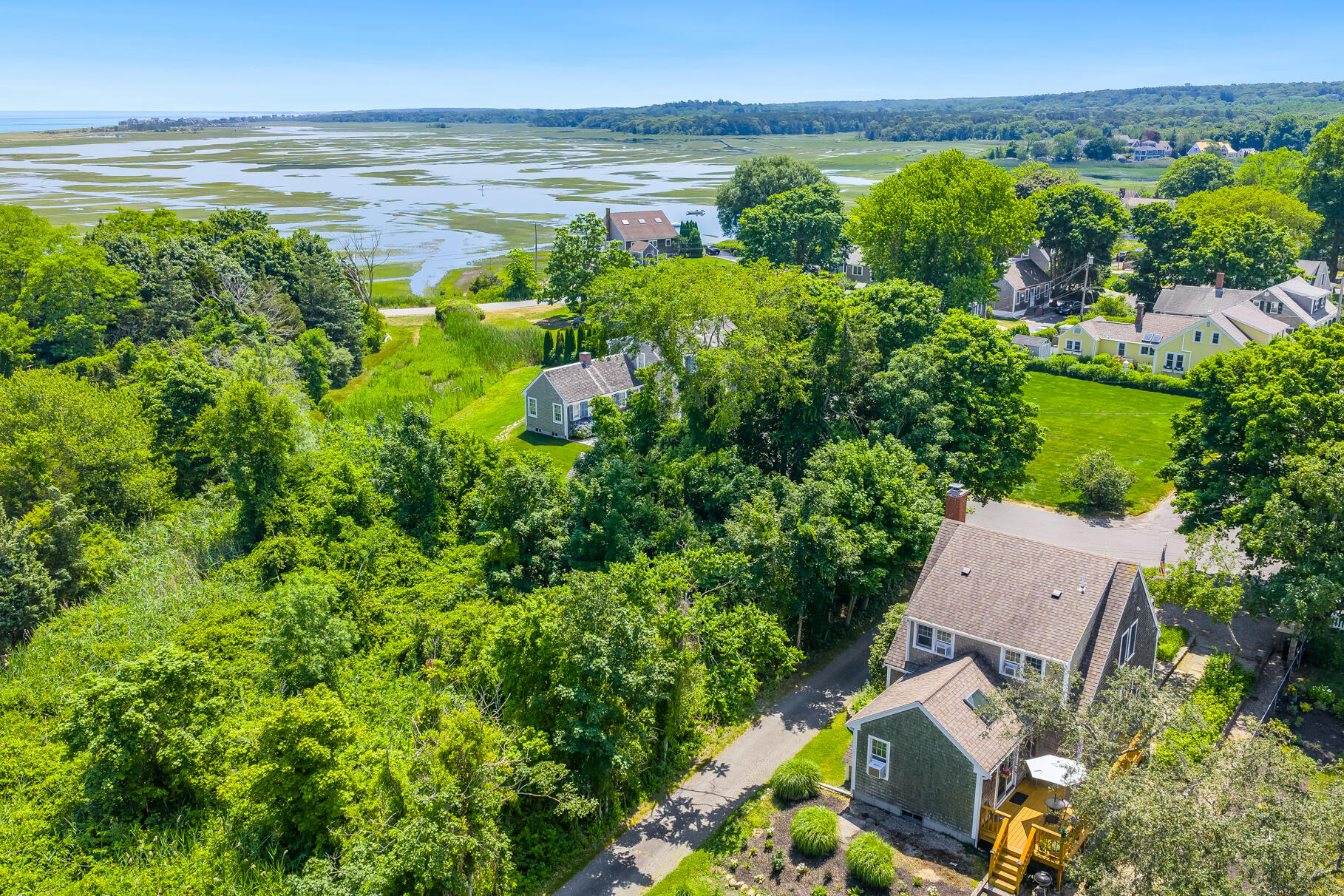 5 Canary Street Sandwich, MA 02563 - Photo 42 of 45 a view of a lake with a house in a yard