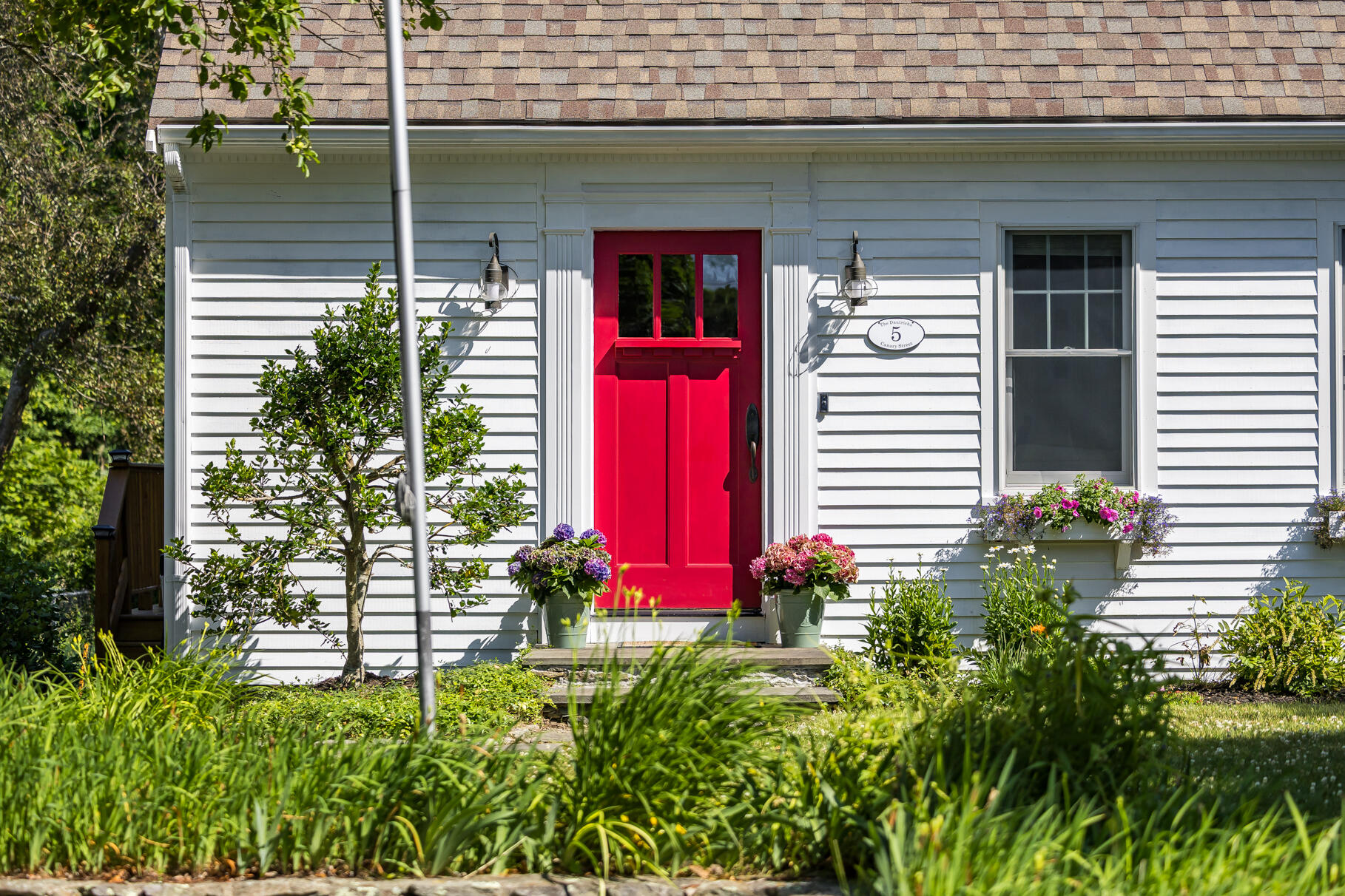 5 Canary Street Sandwich, MA 02563 - Photo 45 of 45 a view of a house with potted plants