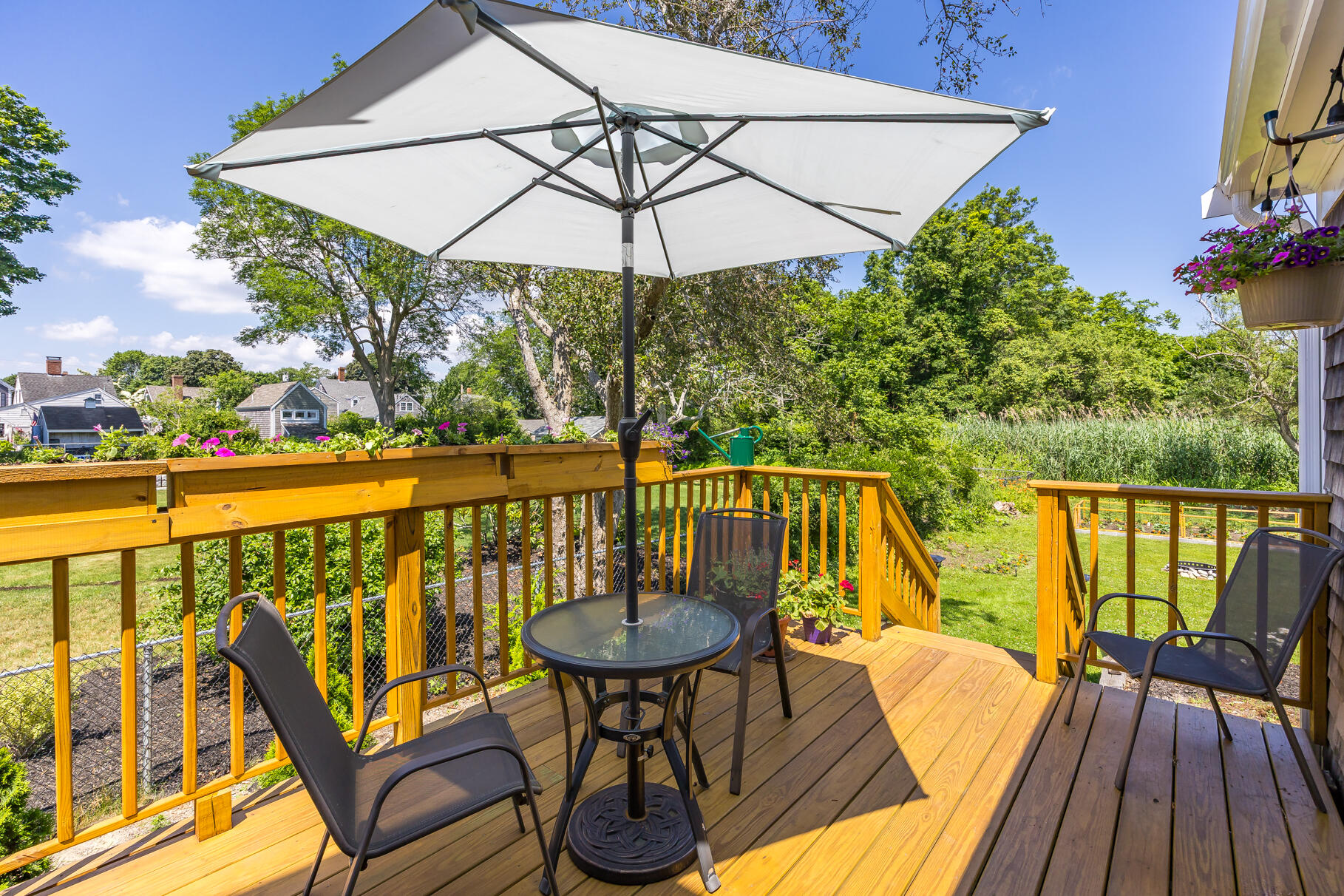 5 Canary Street Sandwich, MA 02563 - Photo 9 of 45 a view of a balcony with chairs and wooden floor