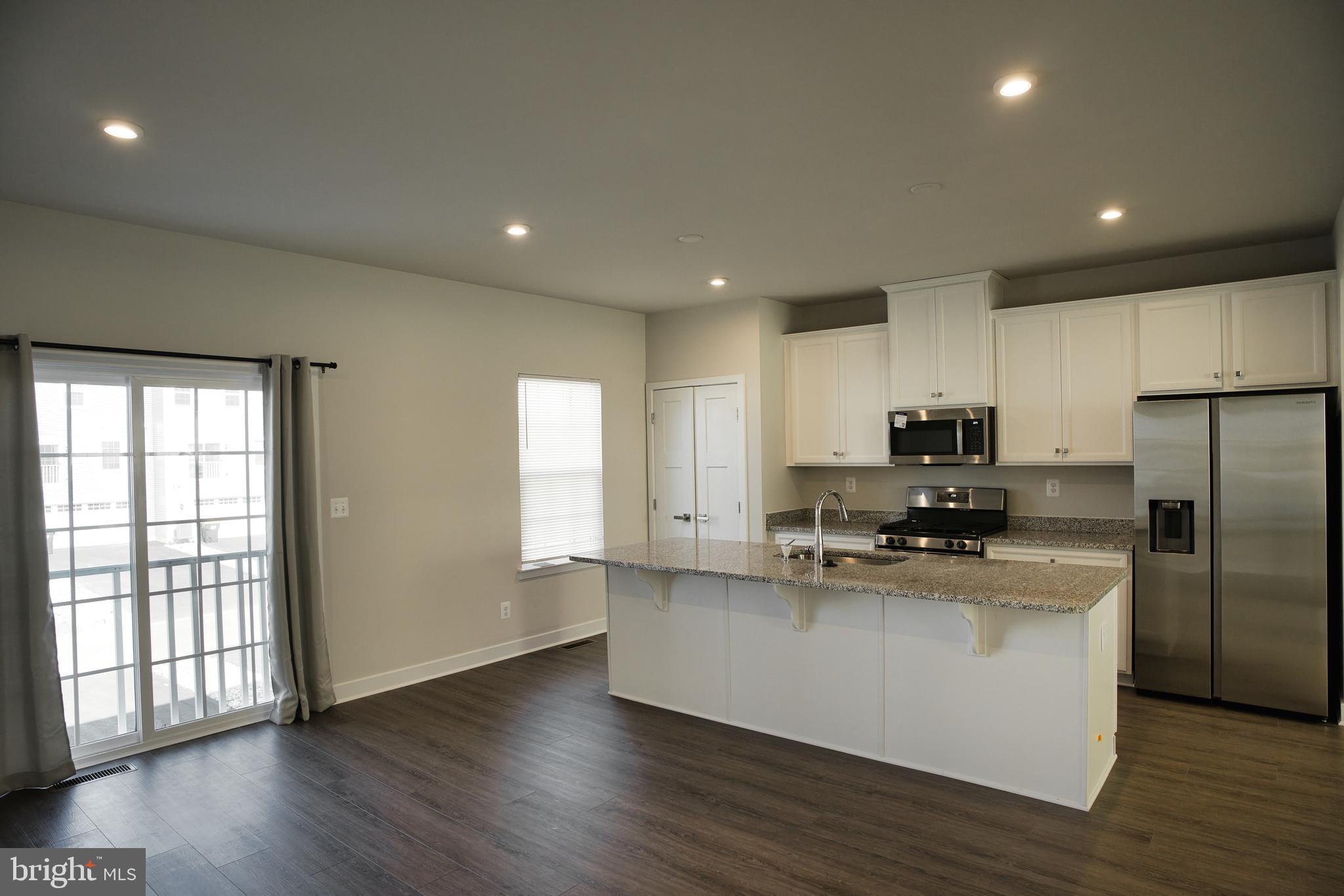 549 Lewes Landing Road Middletown, DE 19709 - Photo 8 of 19 a kitchen with stainless steel appliances a refrigerator sink and microwave
